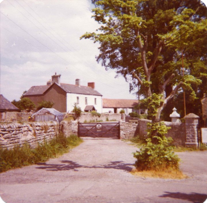 Entrance gate and farmhouse at Tŷ Mawr